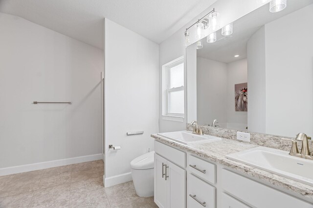 5309 Vespera St, Fort Pierce, FL 34951 - full bathroom featuring toilet, double vanity, and baseboards