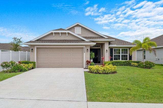 5309 Vespera St, Fort Pierce, FL 34951 - view of front of home with stucco siding, concrete driveway, an attached garage, and a shingled roof