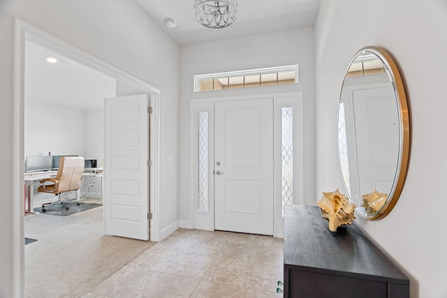 5309 Vespera St, Fort Pierce, FL 34951 - foyer with a chandelier, light tile patterned floors, and light carpet