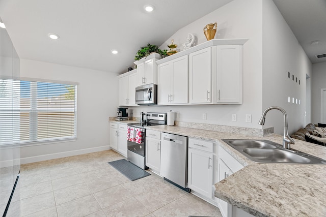 5309 Vespera St, Fort Pierce, FL 34951 - kitchen with appliances with stainless steel finishes, a sink, light countertops, baseboards, and light tile patterned floors
