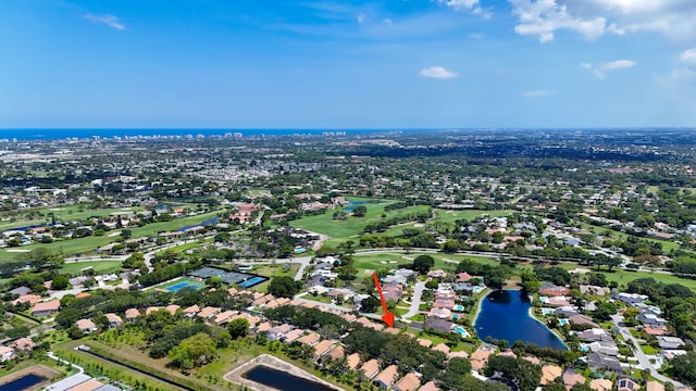 4560 Sherwood Forest Dr, Delray Beach, FL 33445 - aerial view of property and surrounding area featuring a large body of water, nearby suburban area, and a golf course