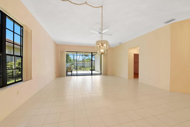4560 Sherwood Forest Dr, Delray Beach, FL 33445 - empty room with a chandelier, a ceiling fan, and a textured ceiling