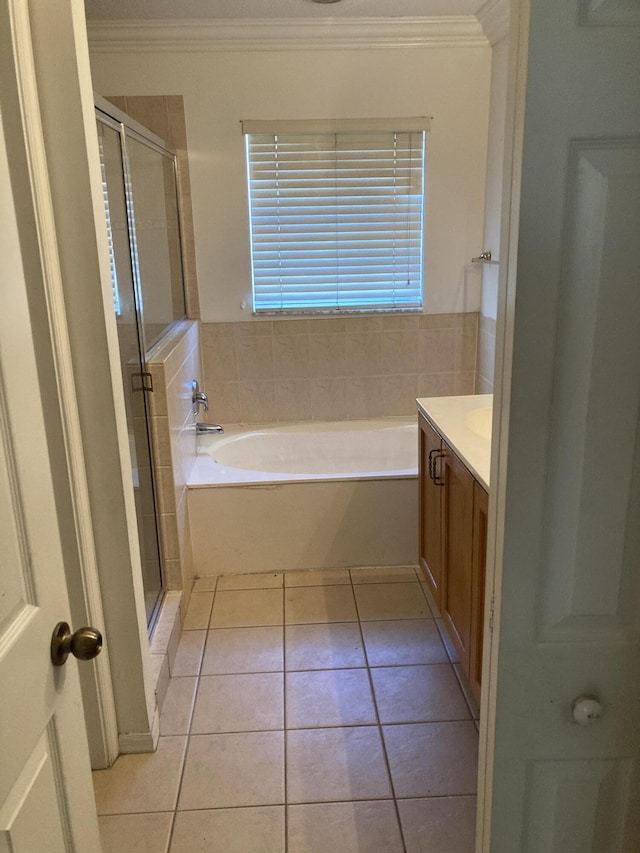 1098 Winding Rose Way, West Palm Beach, FL 33415 - full bathroom featuring crown molding, vanity, a garden tub, a shower stall, and tile patterned floors