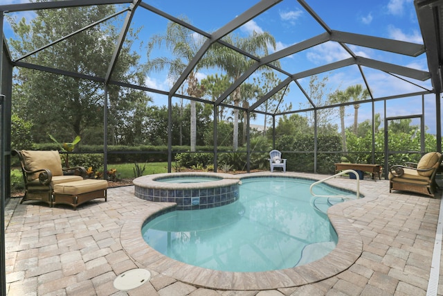 568 SE Monet Dr, Port Saint Lucie, FL 34984 - view of swimming pool featuring a patio area, a pool with connected hot tub, a lanai, and view of scattered trees