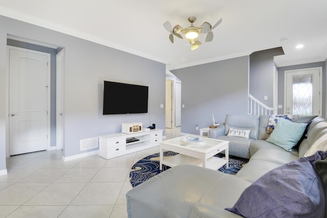 568 SE Monet Dr, Port Saint Lucie, FL 34984 - living area with ceiling fan, ornamental molding, baseboards, light tile patterned flooring, and stairway