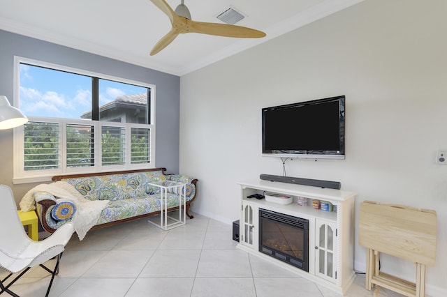 568 SE Monet Dr, Port Saint Lucie, FL 34984 - tiled living room featuring crown molding, ceiling fan, and baseboards