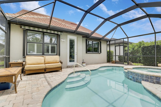 568 SE Monet Dr, Port Saint Lucie, FL 34984 - view of swimming pool with a patio area, a pool with connected hot tub, an outdoor living space, and glass enclosure
