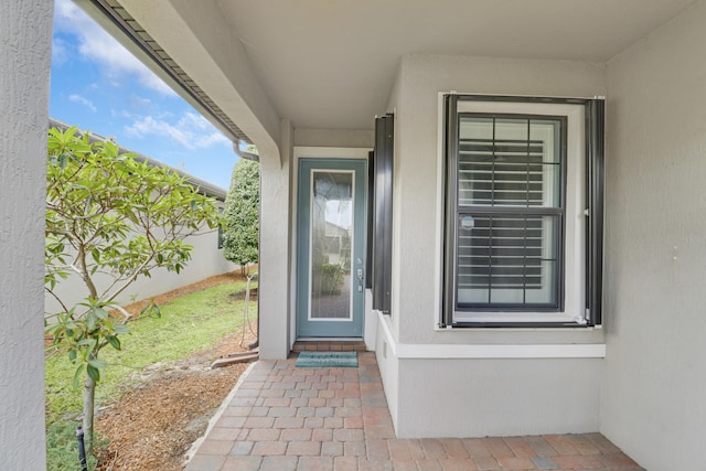 568 SE Monet Dr, Port Saint Lucie, FL 34984 - property entrance with stucco siding