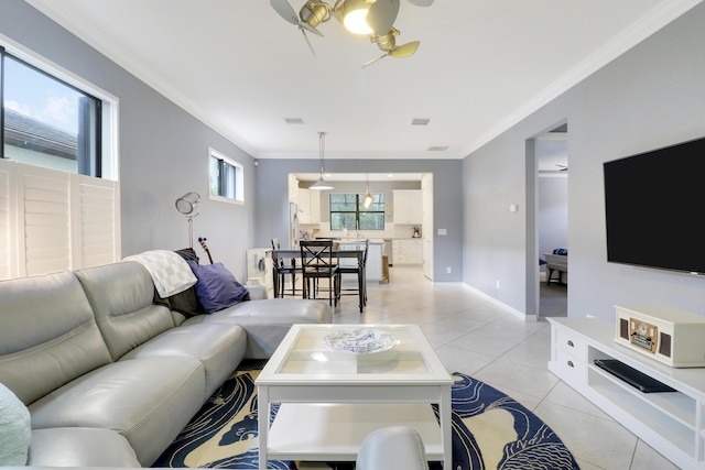 568 SE Monet Dr, Port Saint Lucie, FL 34984 - living area with ornamental molding, a ceiling fan, light tile patterned floors, and baseboards