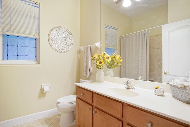 697 SW Dairy Rd, Port Saint Lucie, FL 34953 - full bathroom featuring baseboards, tile patterned flooring, toilet, vanity, and a shower with curtain