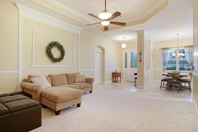 697 SW Dairy Rd, Port Saint Lucie, FL 34953 - living area featuring light carpet, arched walkways, a chandelier, a ceiling fan, and ornamental molding