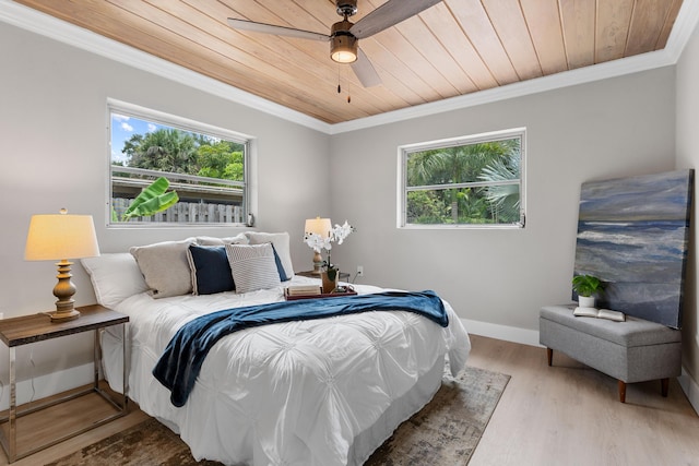 709 SW Bryant Ave, Stuart, FL 34994 - bedroom featuring wooden ceiling, wood finished floors, ornamental molding, baseboards, and ceiling fan