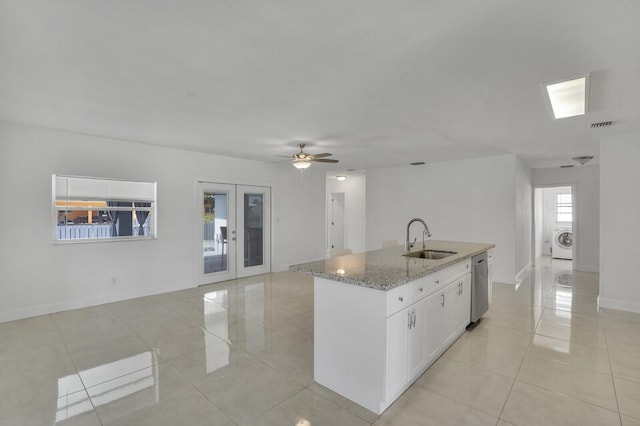 6650 NW 22nd Ct, Margate, FL 33063 - kitchen with a sink, washer / clothes dryer, stainless steel dishwasher, and light tile patterned floors