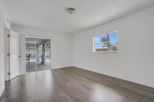 6650 NW 22nd Ct, Margate, FL 33063 - empty room featuring wood finished floors, healthy amount of natural light, and baseboards
