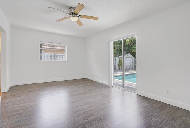 6650 NW 22nd Ct, Margate, FL 33063 - spare room featuring wood finished floors, ceiling fan, and baseboards