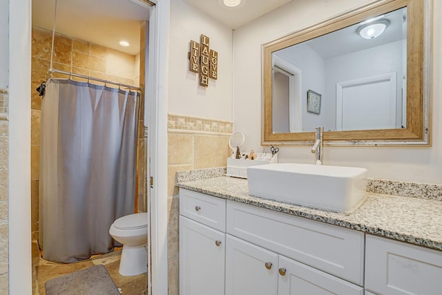 6650 NW 22nd Ct, Margate, FL 33063 - bathroom featuring vanity, tile walls, toilet, and a shower with shower curtain