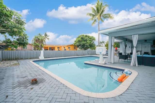 6650 NW 22nd Ct, Margate, FL 33063 - view of swimming pool with a fenced backyard and a patio