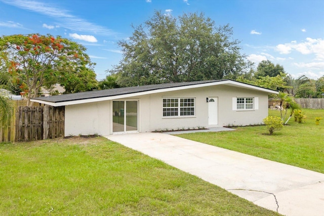 7802 Miramar Ave, Fort Pierce, FL 34951 - back of property featuring stucco siding and concrete driveway