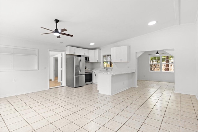 7802 Miramar Ave, Fort Pierce, FL 34951 - kitchen featuring appliances with stainless steel finishes, ceiling fan, a peninsula, light countertops, and white cabinetry