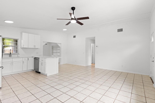 7802 Miramar Ave, Fort Pierce, FL 34951 - kitchen with a peninsula, a ceiling fan, white cabinetry, dishwasher, and open floor plan