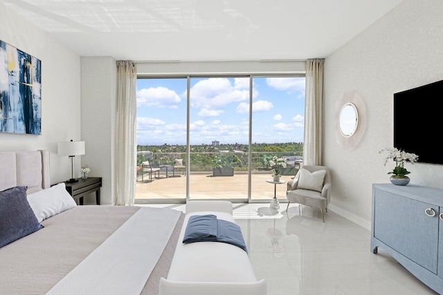 246 NE 6th Ave Unit Ph1, Delray Beach, FL 33483 - tiled bedroom with access to outside, a textured wall, and baseboards