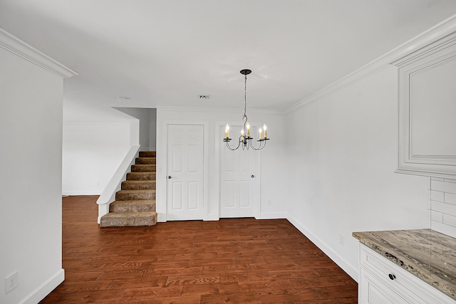 2934 SW 22nd Cir Unit 12A, Delray Beach, FL 33445 - unfurnished dining area with stairs, a chandelier, dark wood finished floors, and crown molding
