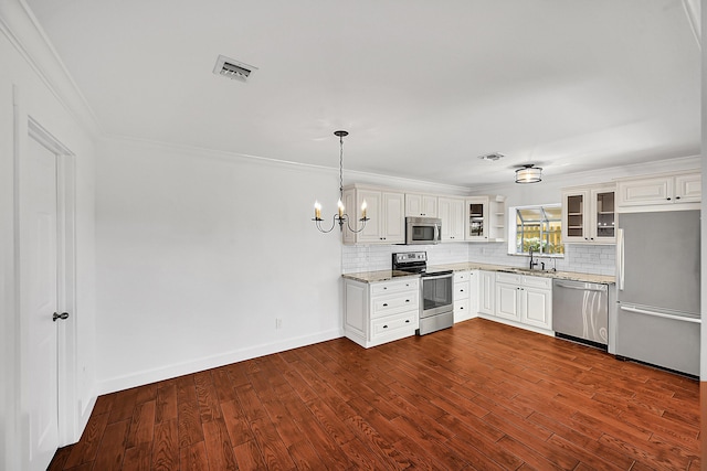 2934 SW 22nd Cir Unit 12A, Delray Beach, FL 33445 - kitchen with appliances with stainless steel finishes, backsplash, light stone counters, dark wood-type flooring, and crown molding