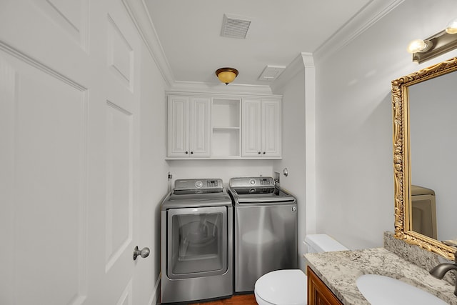 2934 SW 22nd Cir Unit 12A, Delray Beach, FL 33445 - washroom with washer and clothes dryer and ornamental molding