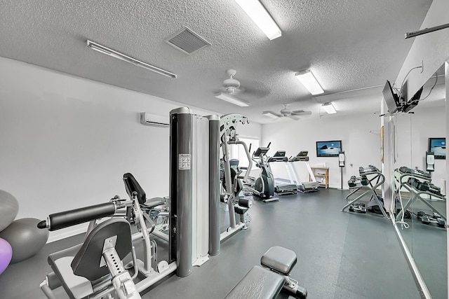 2934 SW 22nd Cir Unit 12A, Delray Beach, FL 33445 - exercise room featuring a textured ceiling and a ceiling fan