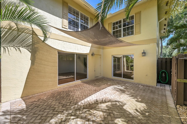 2934 SW 22nd Cir Unit 12A, Delray Beach, FL 33445 - back of house featuring stucco siding and a patio area
