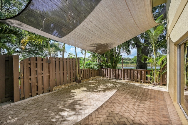 2934 SW 22nd Cir Unit 12A, Delray Beach, FL 33445 - view of patio with a water view and a gate