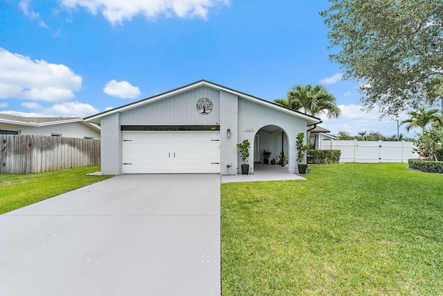 9674 Dogwood Ave, Palm Beach Gardens, FL 33410 - ranch-style home with a garage, driveway, and stucco siding