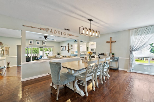 9674 Dogwood Ave, Palm Beach Gardens, FL 33410 - dining room featuring dark wood-style flooring, ceiling fan, and baseboards