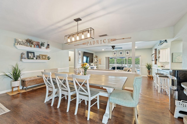 9674 Dogwood Ave, Palm Beach Gardens, FL 33410 - dining area with a ceiling fan, dark wood finished floors, and baseboards