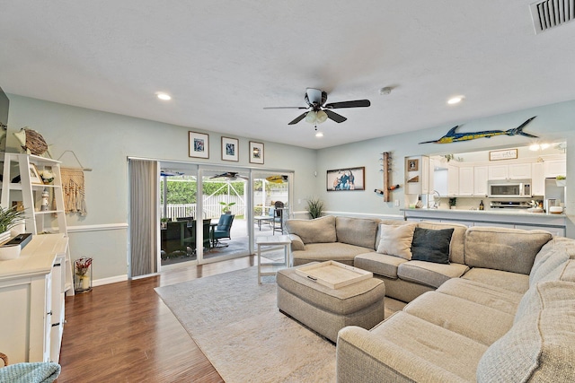 9674 Dogwood Ave, Palm Beach Gardens, FL 33410 - living room with ceiling fan, dark wood-style floors, recessed lighting, and baseboards