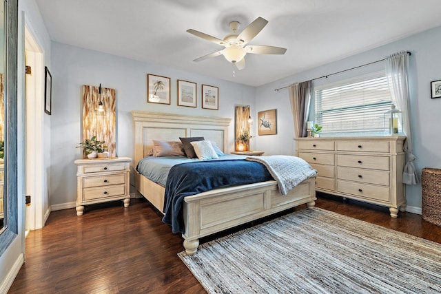 9674 Dogwood Ave, Palm Beach Gardens, FL 33410 - bedroom with dark wood-type flooring, baseboards, and a ceiling fan