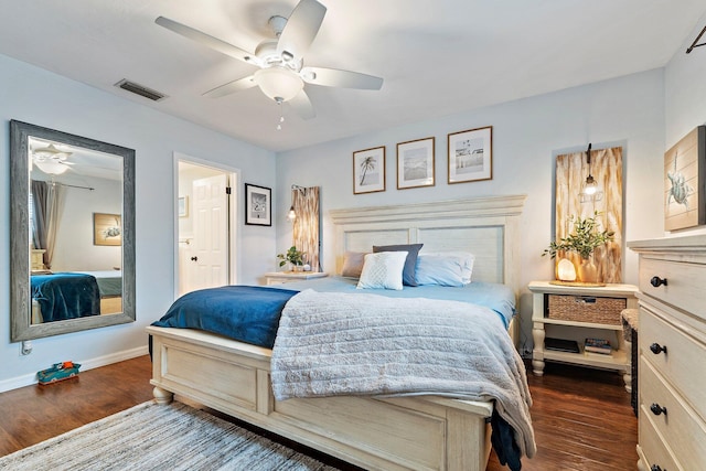9674 Dogwood Ave, Palm Beach Gardens, FL 33410 - bedroom with dark wood-style flooring, baseboards, and ceiling fan