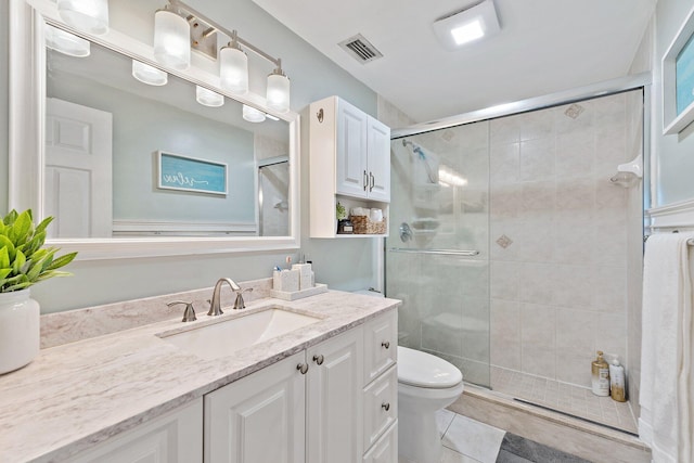 9674 Dogwood Ave, Palm Beach Gardens, FL 33410 - bathroom with toilet, vanity, a shower stall, and tile patterned floors