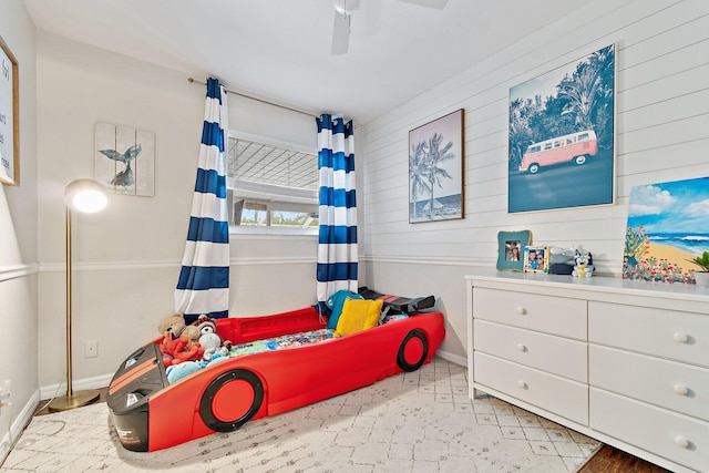 9674 Dogwood Ave, Palm Beach Gardens, FL 33410 - bedroom featuring wooden walls, baseboards, and ceiling fan