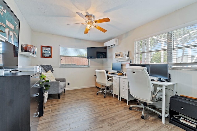 9674 Dogwood Ave, Palm Beach Gardens, FL 33410 - home office with an AC wall unit, ceiling fan, a wainscoted wall, and light wood finished floors