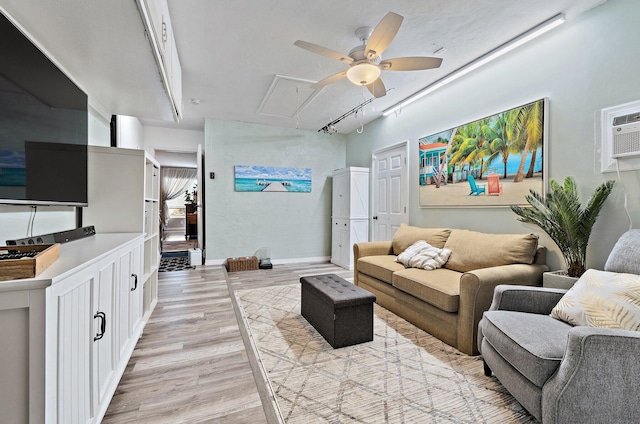 9674 Dogwood Ave, Palm Beach Gardens, FL 33410 - living area with attic access, a ceiling fan, light wood-style floors, baseboards, and rail lighting