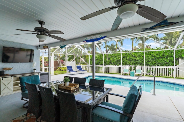 9674 Dogwood Ave, Palm Beach Gardens, FL 33410 - view of swimming pool featuring a ceiling fan, a fenced backyard, a patio area, and a lanai