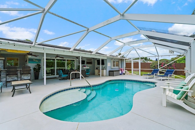 9674 Dogwood Ave, Palm Beach Gardens, FL 33410 - view of swimming pool with a ceiling fan, a patio, and glass enclosure