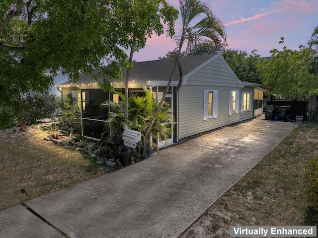 1509 N N St, Lake Worth Beach, FL 33460 - view of front of home with concrete driveway and roof with shingles