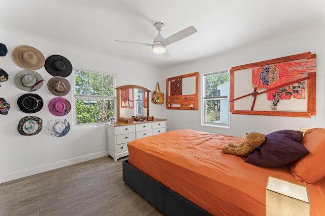 1509 N N St, Lake Worth Beach, FL 33460 - bedroom with multiple windows, wood finished floors, baseboards, and a ceiling fan