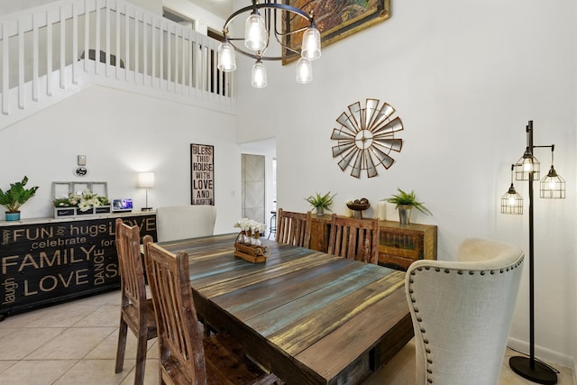 5625 Lakeview Mews Ct, Boynton Beach, FL 33437 - dining space with a chandelier, light tile patterned floors, a towering ceiling, and stairs