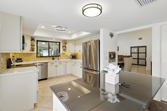 5625 Lakeview Mews Ct, Boynton Beach, FL 33437 - kitchen with appliances with stainless steel finishes, open shelves, a sink, decorative backsplash, and a raised ceiling