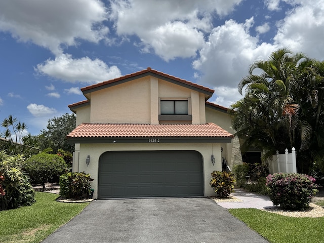 5625 Lakeview Mews Ct, Boynton Beach, FL 33437 - mediterranean / spanish house with asphalt driveway, stucco siding, and a tile roof