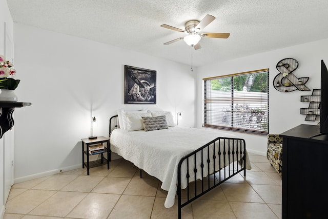 5625 Lakeview Mews Ct, Boynton Beach, FL 33437 - bedroom with light tile patterned floors, a textured ceiling, baseboards, and a ceiling fan