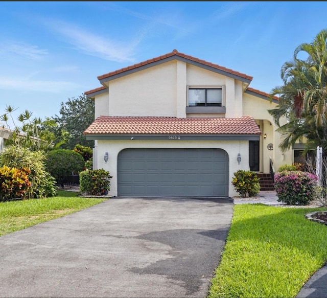 5625 Lakeview Mews Ct, Boynton Beach, FL 33437 - mediterranean / spanish house with driveway, stucco siding, a tiled roof, and an attached garage